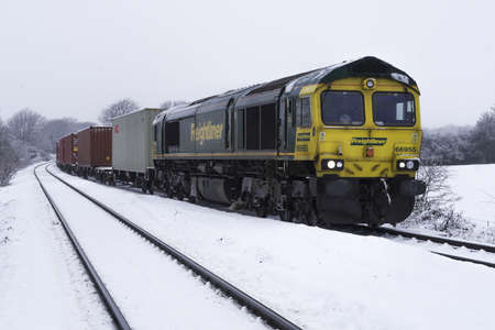 DONCASTER, FEBRUARY 2, 2021.  A Freightliner Intermodal freight train carrying import and export shipping containers to terminals and ports across the UKのeditorial素材