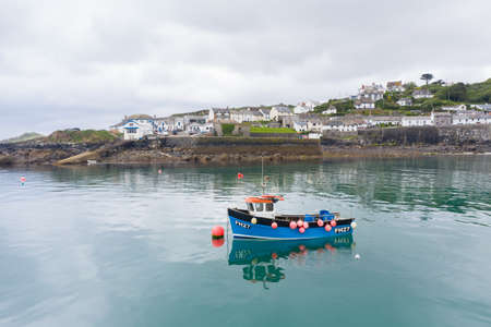 COVERACK, CORNWALL, UK - JUNE 24, 2021.   A traditional Cornish fishing boat outside the harbour of the picturesque fishing village of Coverack in Cornwall, UKのeditorial素材