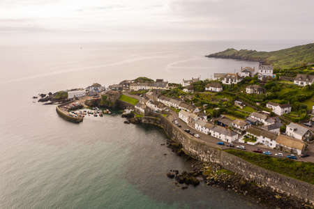 COVERACK, CORNWALL, UK - JUNE 29, 2021.  Aerial view of the picturesque harbour and fishing village of Coverack in Cornwall, UKのeditorial素材