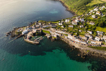 COVERACK, CORNWALL, UK - JUNE 30, 2021.  Aerial view of the picturesque harbour and village of Coverack in Cornwall, UKのeditorial素材