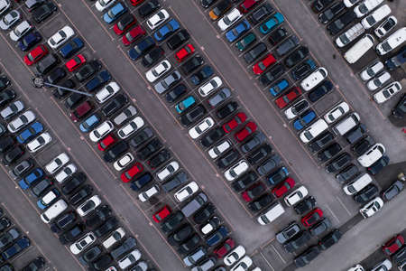 Aerial view of rows of parked cars lined up for sale or for export and import to the UK