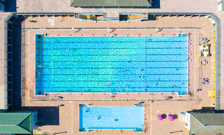 An aerial view of an outdoor Lido swimming pool in Summer sunshineの写真素材
