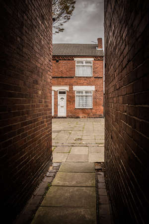 A rundown terraced house and back alleys in the North of England, UKの写真素材
