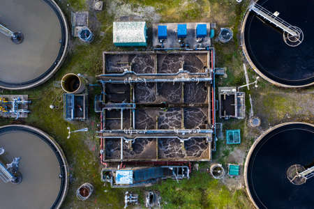Aerial view of the tanks of a UK sewage and water treatment plant enabling the discharge and re-use of waste water and re-use of waste waterの写真素材