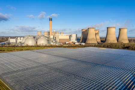 DRAX POWER STATION, DRAX, UK - JANUARY 19, 2022.  An aerial view of Drax Power Station and the greenhouses that grow salad and vegetables from the excess heat that the power station usesのeditorial素材