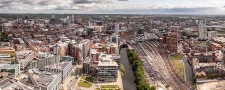 LEEDS,UK - MAY 12, 2022.  An aerial cityscape of Leeds city centre with train station and modern buildings along the Leeds to Liverpool canalのeditorial素材
