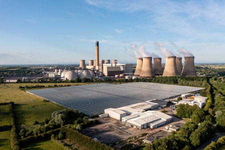 DRAX, UK - JUNE 20, 2022.  Drax coal fired power station utilises its excess heat to heat greenhouses at English Village Salads factory for food productionのeditorial素材