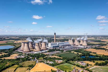 Aerial landscape view of Drax Power Station in North Yorkshire with smoking chimneys and cooling towers pumping CO2 into the atmosphereの写真素材