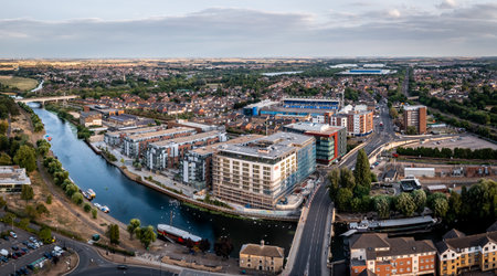 PETERBOROUGH, UK - AUGUST 4, 2022.  An aerial view of The Fletton area of Peterborough including the River Nene and The Weston Homes Stadium home of Peterborough United Football Clubのeditorial素材