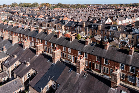 Aerial view of old terraced houses on back to back streets in the suburbs of a large UK cityの写真素材