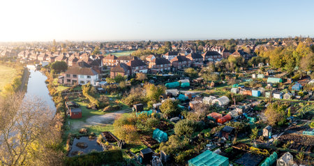 An aerial view of local council run allotment plots on the edge of a picturesque townの写真素材