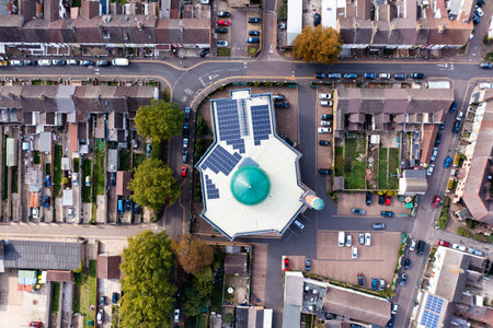 Aerial view of a Muslim neighbourhood in a UK city with a Mosque at the centerの写真素材