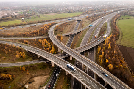 FERRYBRIDGE, YORKSHIRE, UK - DECEMBER 1, 2022.  An aerial view above a complex motorway junction with slip roads and overbridges connecting the M62 and A1 motorways in the UKのeditorial素材