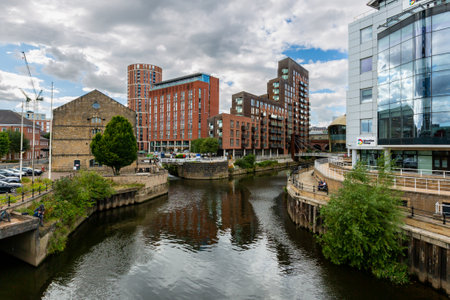 GRANARY WHARF, LEEDS, UK - AUGUST 5, 2022.  A landscape view of Granary Wharf in the centre of Leeds city with the Leeds to Liverpool canal and luxury waterfront propertiesのeditorial素材