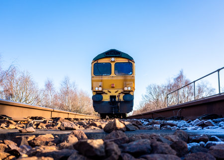 A point of view image of the front of a freight locomotive moving towards a person on the railway line in a suicide or occupational safety conceptの写真素材