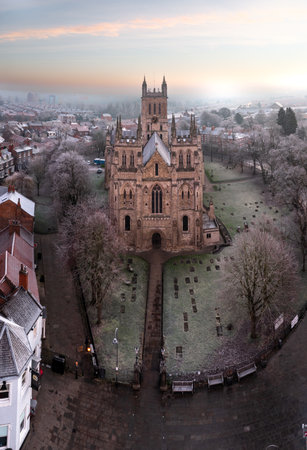 SELBY, NORTH YORKSHIRE, UK - JANUARY 22, 2023.  An aerial view of the market town of Selby with the ancient architecture of Selby Abbey at sunrise on a cold Winter morningのeditorial素材