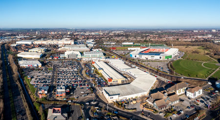 DONCASTER, UK - JANUARY 19, 2023. Aerial view of the Lakeside Village shopping centre and Doncaster Rovers Football Club Eco Power stadium in a Doncaster cityscape skylineのeditorial素材