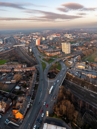 DONCASTER, UK - FEBRUARY 14, 2023.  An aerial panorama view of Doncaster cityscape skyline at sunset with road and rail accessのeditorial素材