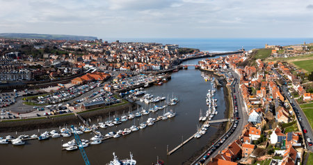 WHITBY, UK - MARCH 12, 2023.  An aerial landscape of the harbour and seaside town of Whitby in North Yorkshireのeditorial素材