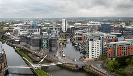 LEEDS DOCK, LEEDS, UK - MAY 2, 2023. An aerial panoramic view of a Leeds cityscape skyline with modern architecture and exclusive riverside apartment blocks in the Leeds Dock developmentのeditorial素材