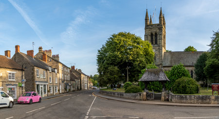 HELMSLEY, NORTH YORKSHIRE, UK - MAY 29, 2023.  Street view of the local Parish Church of All Saints in the popular tourist destination of Helmsley in Yorkshireのeditorial素材