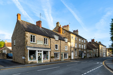 HELMSLEY, UK - MAY 29, 2023.  Landscape panorama of small independent shops in the popular tourist...