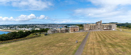 PENDENNIS CASTLE, FALMOUTH, CORNWALL, UK - JULY 5, 2023. Panorama landscape of the military barracks at Pendennis Castle in Cornwall with Falmouth in the backsgroundのeditorial素材