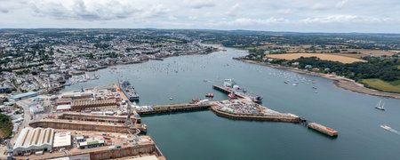 FALMOUTH, CORNWALL, UK - JULY 5, 2023.  Aerial landscape panorama view of the docks and harbour in Falmouth with Royal Navy fleet auxillary ships docked for resupplyのeditorial素材