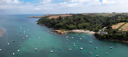 An aerial landscape view of the small Cornish village of Gillan which is a popular tourist and sailing destination on the South West Coast Path in Cornwallの写真素材
