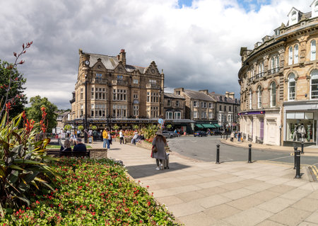 PROSPECT SQUARE, HARROGATE, UK - AUGUST 6, 2023.  A panoramic exterior of the Victorian architecture of Prospect Square with the war memorial and Betty's Cafe and Tea Rooms in Harrogate, North Yorkshireのeditorial素材