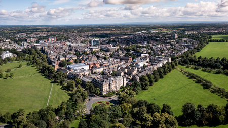 An aerial cityscape panorama landscape of Harrogate town centre in North Yorkshire with The Stray public park and Victorian architectureのeditorial素材