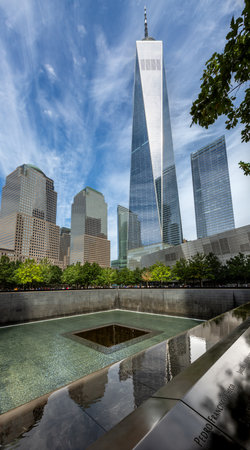 GROUND ZERO, NEW YORK, USA, - SEPTEMBER 16, 2023.  A vertorama landscape of the reflecting pool...