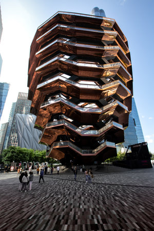 HUDSON YARDS, MANHATTAN, NEW YORK, USA - SEPTEMBER 19, 2023. Vertorama landscape of the intricate architecture of The Vessel at Hudson Yards in New York City at sunsetのeditorial素材