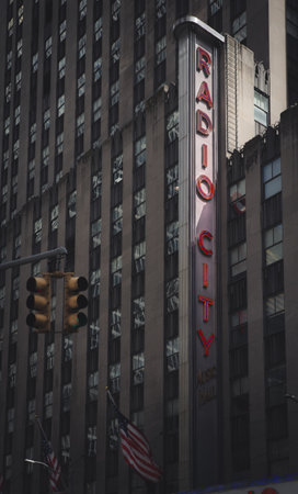 RADIO CITY MUSIC HALL, NEW YORK, USA, - SEPTEMBER 15, 2023.  A vintage edit of the famous neon sign of The Radio City Music Hall in a vertical landscape with copy spaceのeditorial素材