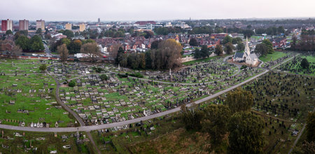 DONCASTER, UK - OCTOBER 17, 2023. Aerial view directly above Hyde Park Cemetery in Doncaster, South Yorkshire with rows of graves and tombstones in a grief or bereavement concept with copy spaceのeditorial素材