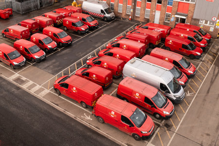 LEEDS, UK - FEBRUARY 16, 2024.  Aerial view of a fleet of parked Post Office deliver vehicles parked at a depotのeditorial素材