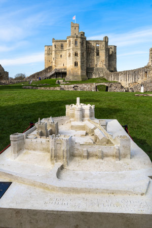 WARKWORTH CASTLE, NORTHUMBERLAND, UK - MARCH 16, 2024. A vertical view of Warkworth Castle Keep in Northumberland with a to scale model in the groundsのeditorial素材
