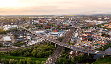 Aerial landscape view of Doncaster cityscape skyline with rail and road transport links serving the South Yorkshire city centre at sunriseの写真素材