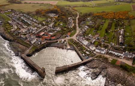 Aerial landscape panorama of the Northumberland fishing village of Craster which is famous for it's smoked kippersの写真素材