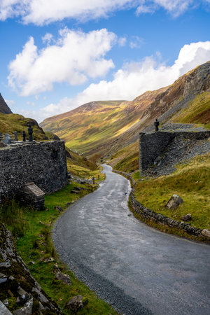 A vertical landscape view of the top of the  B5289 Honister Pass road from The Honister Slate Mine in The English Lake District National Park on a sunny Summer dayの写真素材