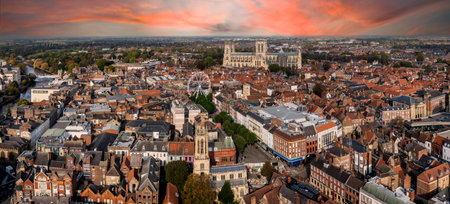 An aerial landscape view of a York cityscape skyline in North Yorkshire, UK with York Minster cathedral and the rooftop of historic buildings in the city centre with Summer sunの写真素材