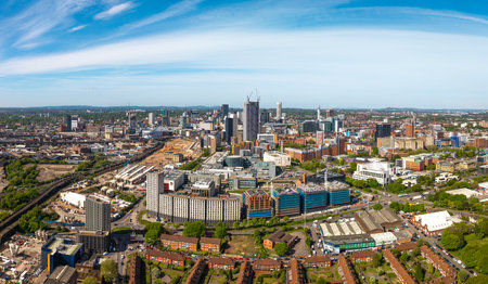 A panoramic aerial view of a Birmingham cityscape skyline in the UK with Birmingham and Aston University buildings and the skyscraper buildings in the city centre with HS2 construction siteの写真素材
