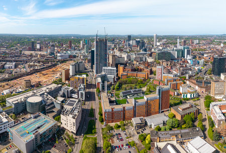 A panoramic aerial view of a Birmingham cityscape skyline in the UK with Birmingham and Aston University buildings and the skyscraper buildings in the city centre with HS2 construction siteの写真素材