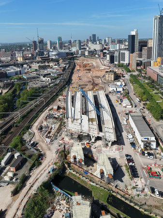 An aerial vertical view of Birmingham cityscape skyline with the HS2 construction site and railway tracks running alongside University buildings towards the new Curzon Street stationの写真素材
