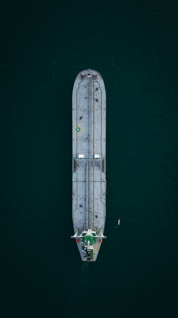 Aerial view directly above a large crude oil product tanker ship on the high seas transporting oil and petroleum products around the worldの写真素材