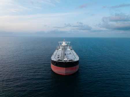 Aerial view above a large crude oil product tanker ship on the high seas transporting oil and petroleum products around the worldの写真素材