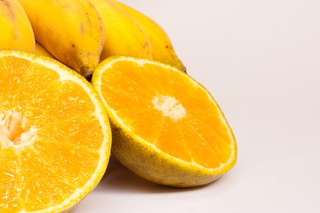 orang and banana on white backgroundの写真素材