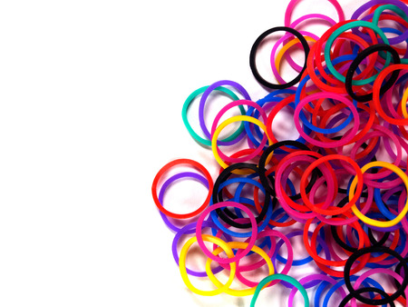 Colorful rubber band background with white isolate, studio shot.