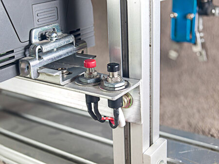 Red and black push button electric switch.