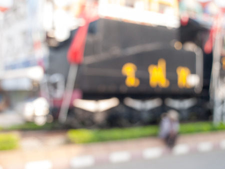 Natural bright blurred background of old man at old train monument.の写真素材